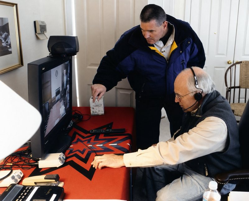 Bill Armour assisting Vice President Dick Cheney with video teleconference equipment in Jackson Hole.